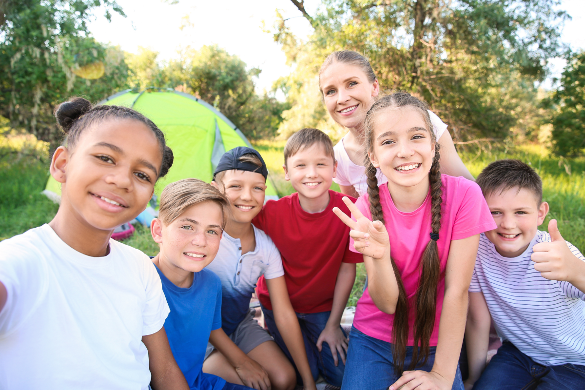 School age children smiling at camera