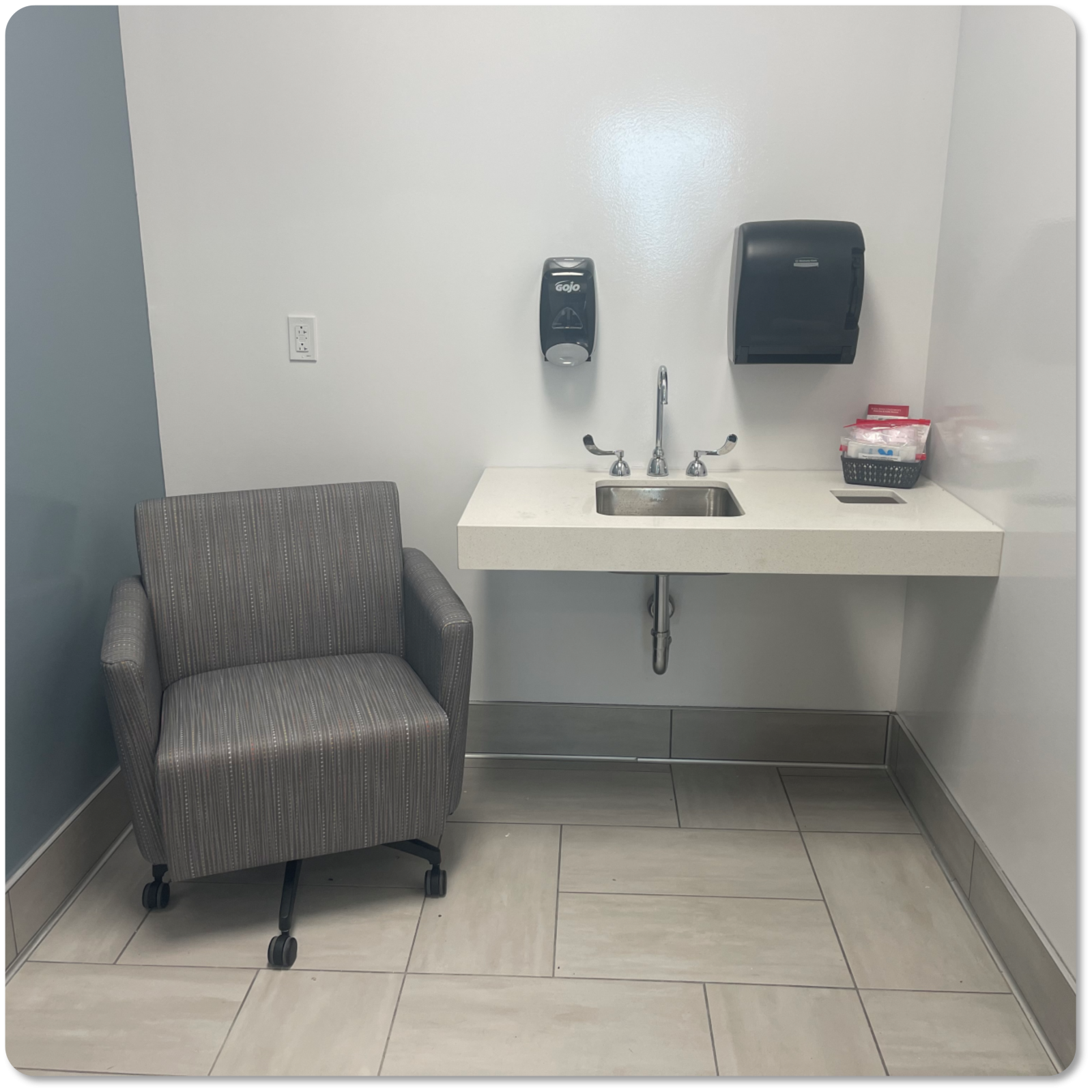 Chair and sink in room